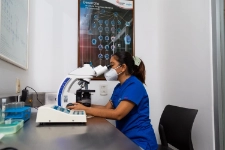 Doctor checking micorscope